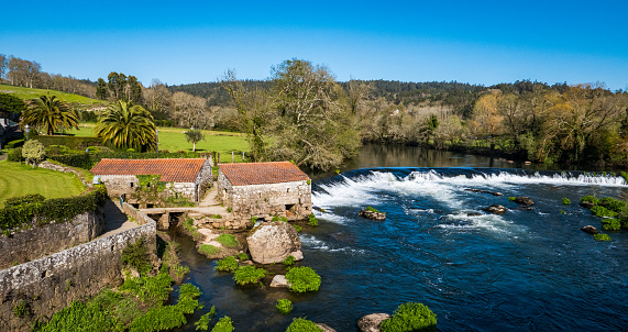 A Ponte Maceira, Galicia, Spain - April 4, 2023: River Tambre through the village