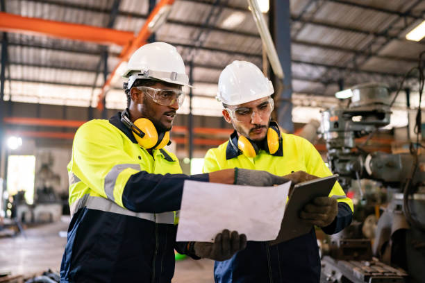 istock Technical engineer workers working in control room plant at industry factory to service maintenance on engineering machine, production technician occupation in global industrial business concept 1487273816