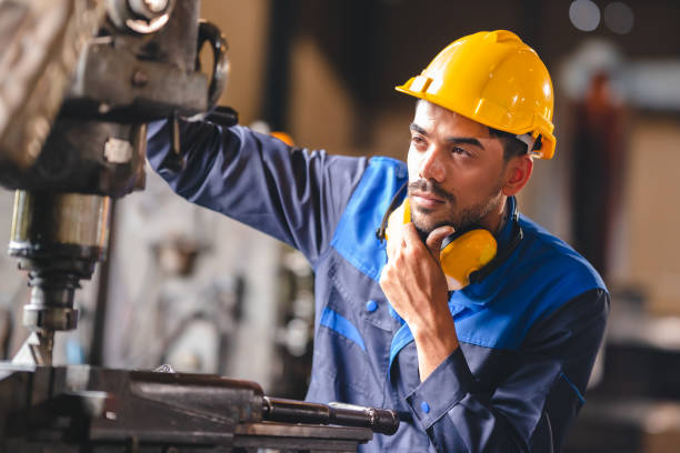 istock Technical engineer workers working in control room plant at industry factory to service maintenance on engineering machine, production technician occupation in global industrial business concept 1487275641