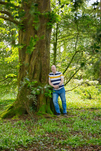 istock Man aged 60 during a woodland walk 1487275742