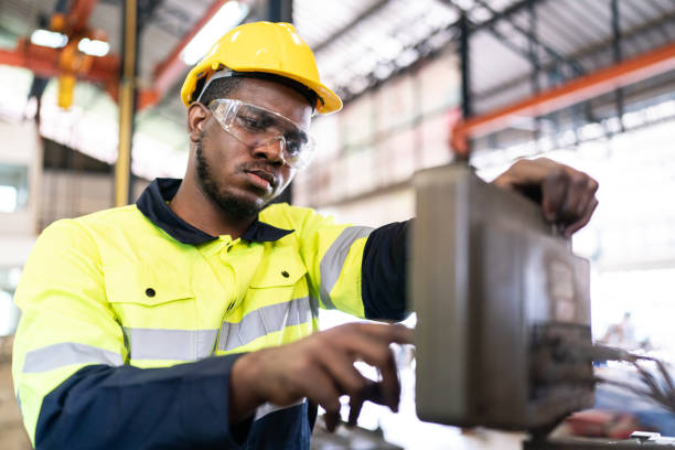 istock Robot machine electricity control box, Electronic technology for production factory industry, Professional technician engineer person are work with mechanical equipment tool for automation maintenance 1487276742
