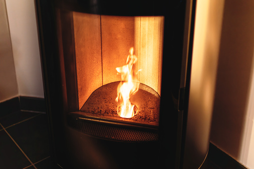 Hearth of a pellet stove, granules stove with flames