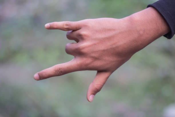 three fingers in one hand are open and the rest are wrapped