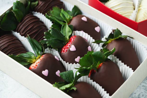 istock Gourmet chocolate covered strawberries on the light background. 1487279059