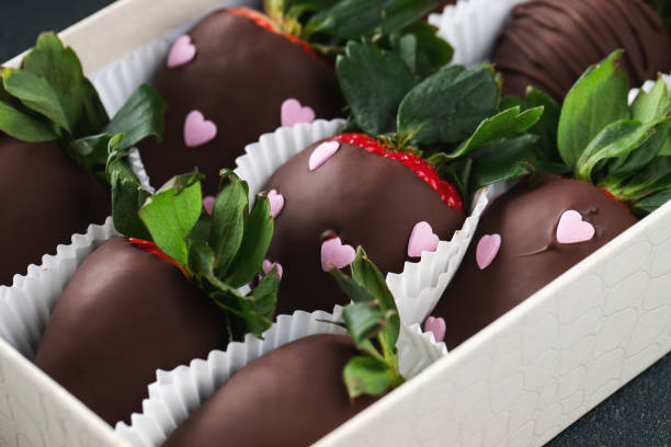 istock Gourmet chocolate covered strawberries on the dark background. 1487279070