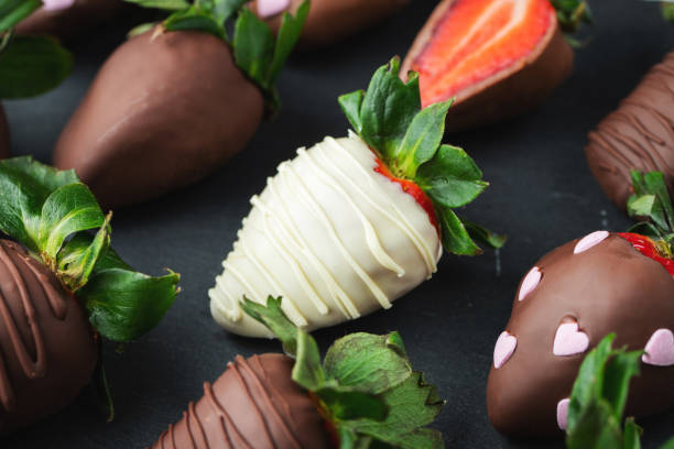 istock Gourmet chocolate covered strawberries on the dark background 1487279084