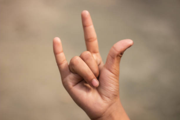 istock three has two fingers open and the rest are folded and the background is blurred 1487279230