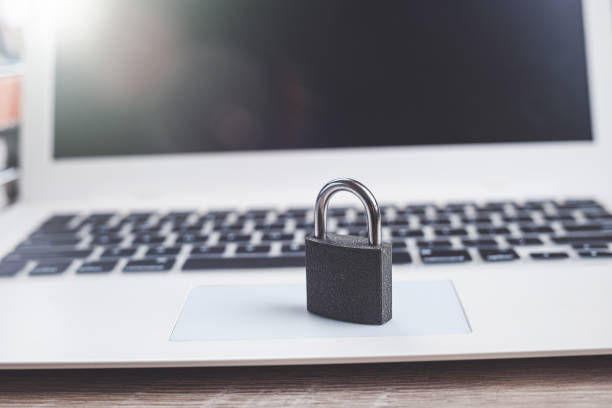 istock Black lock on the white laptop keyboard close up 1487280121