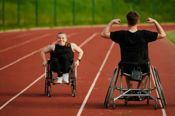 An inspiring couple with disability showcase their incredible determination and strength as they train together for the Paralympics pushing their wheelchairs in marathon track.