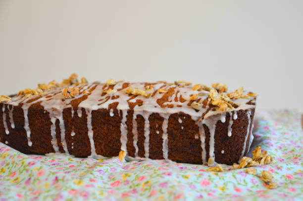Lemon drizzle cake with icing pouring down the side stock photo