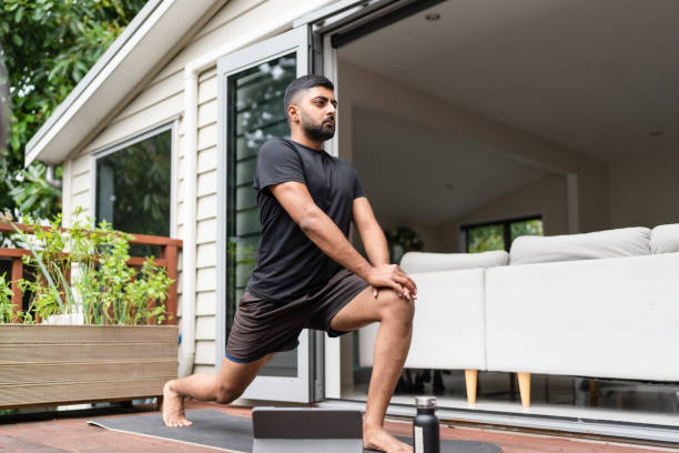 istock young adult stretching 1487281676