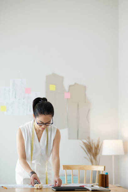 istock Designer Working on Fashion Sketches 1487281975