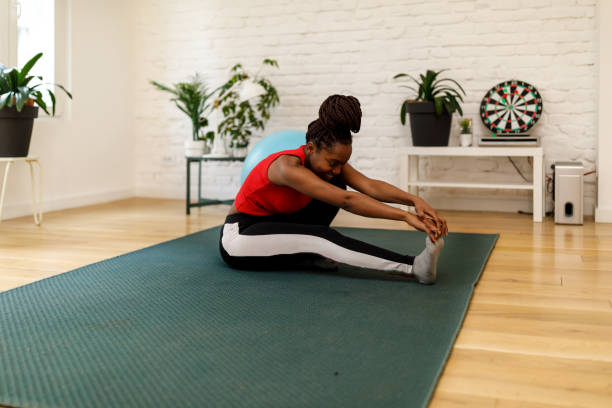 istock A young African-American is stretching her body and preparing for morning training. 1487282238