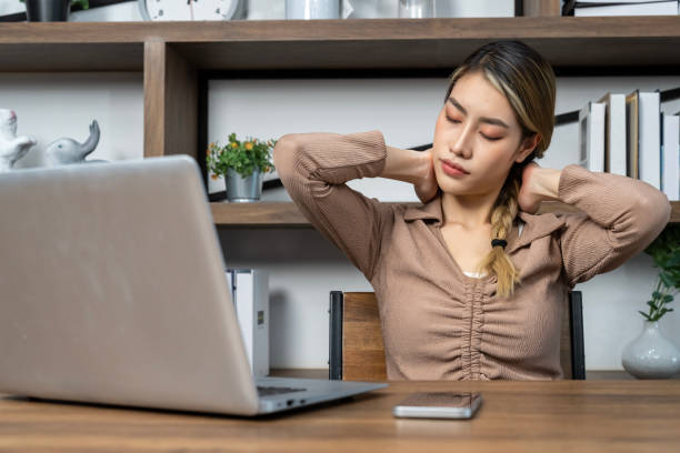 istock Young woman working on laptop computer at home 1487282436