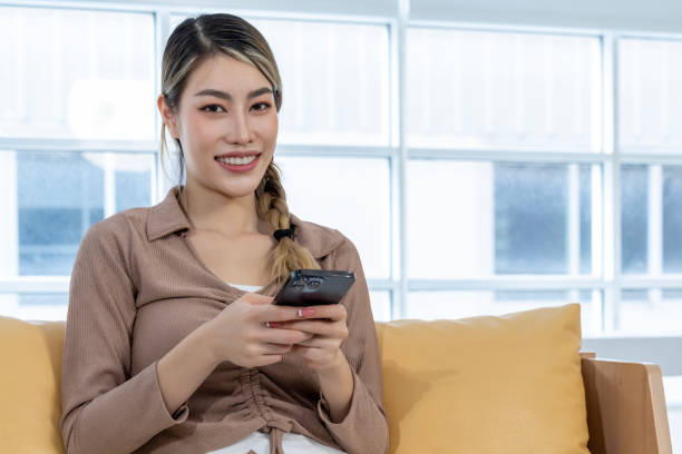 istock Young woman use smartphone in relax time at home 1487283895