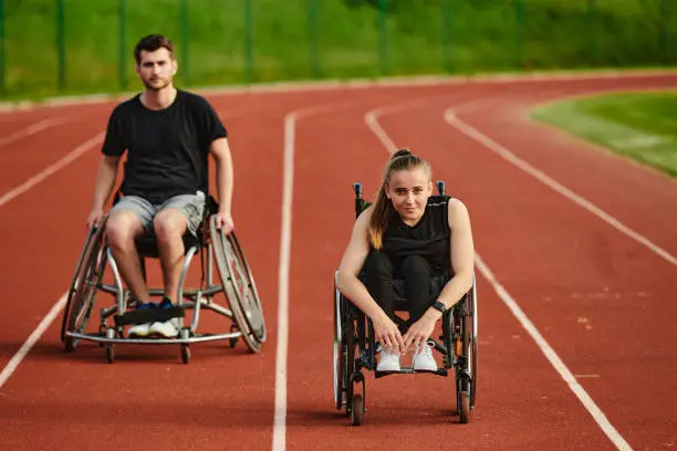 An inspiring couple with disability showcase their incredible determination and strength as they train together for the Paralympics pushing their wheelchairs in marathon track.