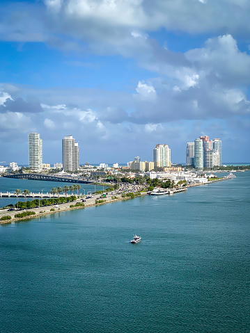 Scenic view of Miami Beach skyline, Florida, United States against blue sky with clouds