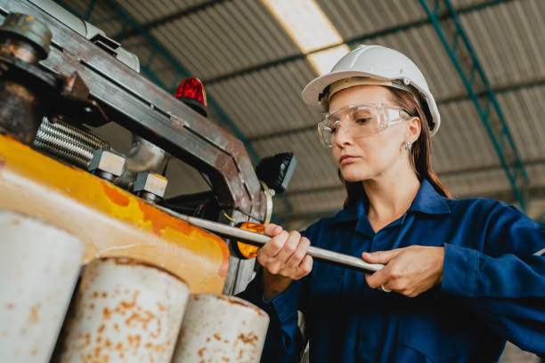 istock Professional engineer women worker or mechanical foreman working to maintenance and check in factory warehouse, engineering women training workshop for factory operators, Business factory industry. 1487285403
