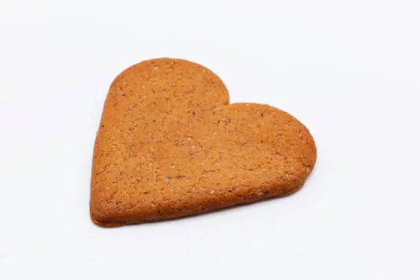 a heart-shaped gingerbread on white background