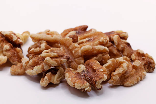 istock a pile of walnuts on a white background 1487286064