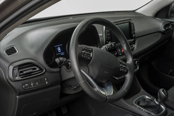 istock Car interior with a steering wheel, control buttons and manual shift 1487286222