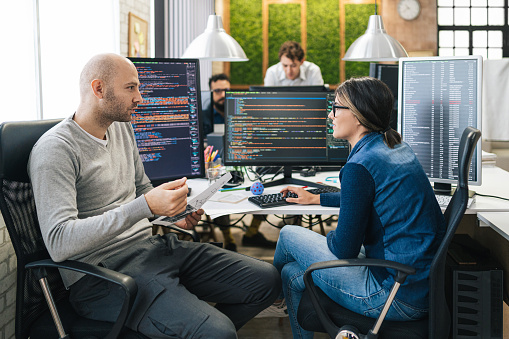 Software Programmers Analyzing Html Code And Database Brainstorming ...