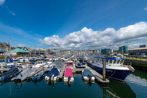 Plymouth, UK. 2 April 2023. Boats moored in Sutton Harbour in the Barbican area of Plymouth.