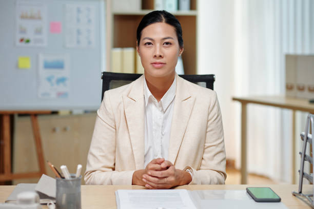 istock Businesswoman Working with Documents 1487289560