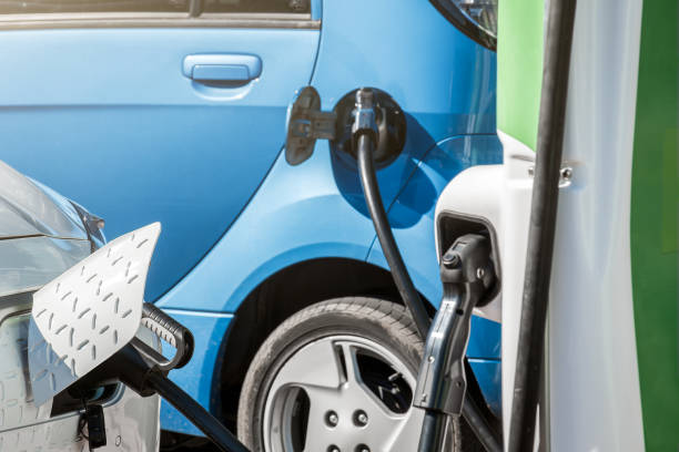 istock Electric car connected to EV charging station 1487289622