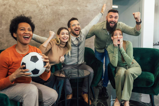 istock Group of friends watching game in cafe. 1487289812