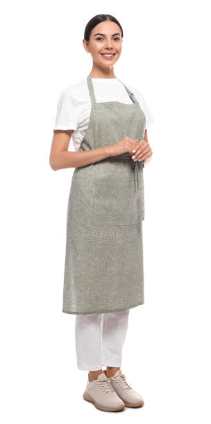 Young woman in light green apron on white background