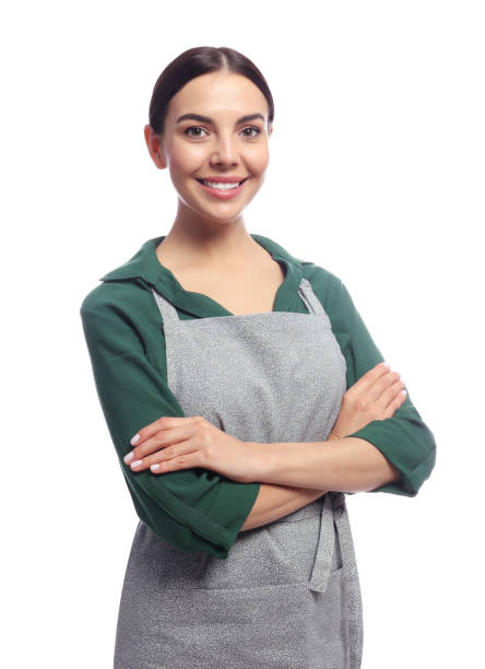 istock Young woman in grey apron on white background 1487289939