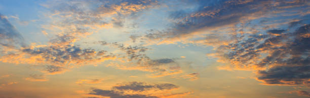 istock clouds and orange sky,Real amazing panoramic sunrise or sunset sky with gentle colorful clouds. Long panorama, crop it 1487290366