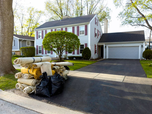 Rugs from home remodeling project waiting for trash pickup
