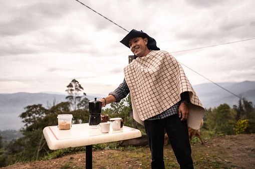 Mature man making a coffee break in the farmhouse