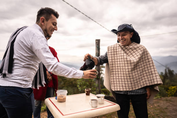 Friends talking while drinking coffee in the farm