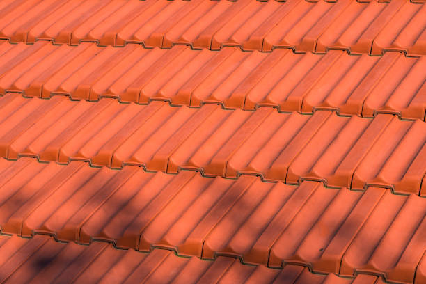 Aged flaked clay roof tiles, texture