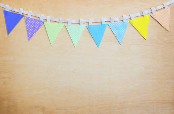 istock Colorful bunting flag on wooden wall background 1487295986