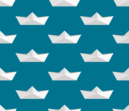 Seamless pattern with paper boats on a blue background.