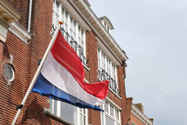 istock Dutch flags waving in the wind on king's day 1487297633