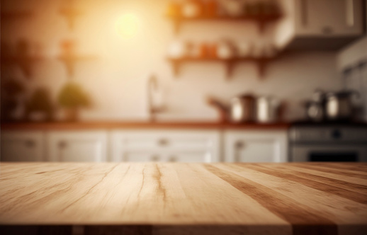 empty brown wooden table top and blurred defocused modern kitchen interior background