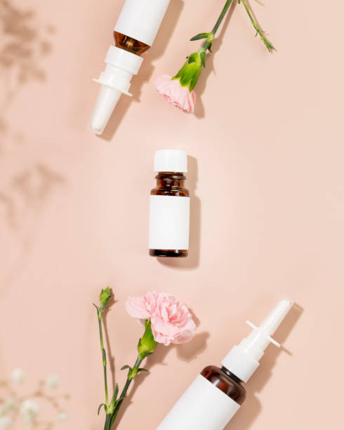istock Natural nasal drops, moisturizing spray and oil on pink background 1487302184