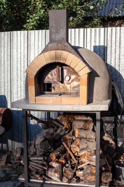 istock Cooking real pizza in a brick oven. Wood and fire are burning 1487302300