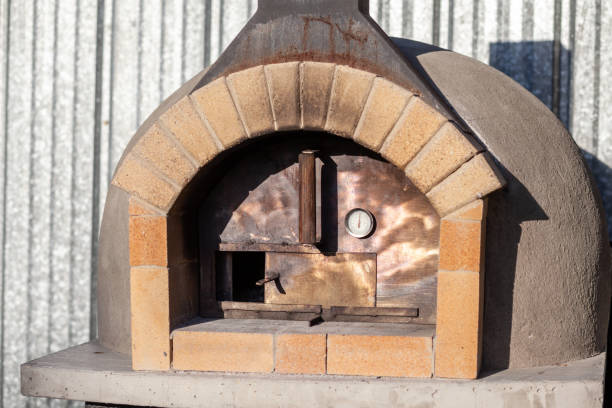 istock Cooking real pizza in a brick oven. Wood and fire are burning 1487302429