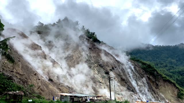 geothermal hot springs steam emissions with hydrogen sulfide in the mountains of the Philippines Asia
