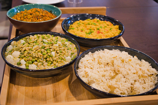 Four different vegetarian meals in bowls