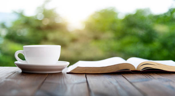 istock Drink coffee and book on the table 1487304613