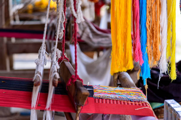 istock Traditional woven fabric Mae Chaem pattern that has not finished weaving in the loom at Mae Chaem District, Chiang Mai Province, Thailand 1487306471