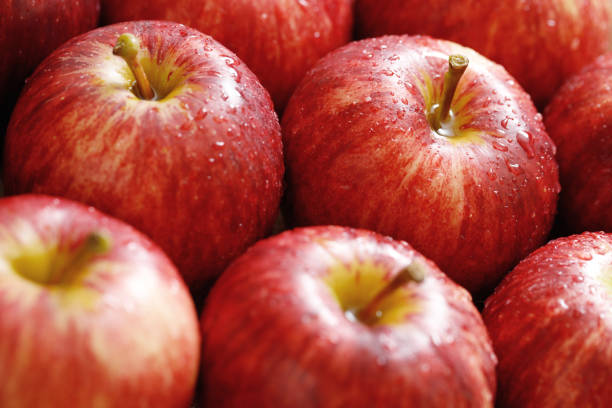 istock fresh red apple texture background in the supermarket 1487308014