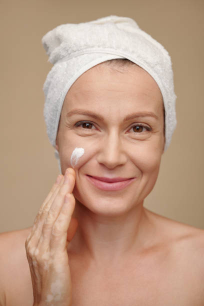 istock Woman Applying Moisturizing Lotion 1487308254